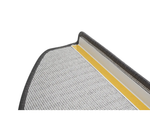 Detaljvy av en dörrmatta med tejp för fastsättning