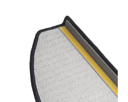 Utsnitt av en dörrmatta med baksidesbeläggning och textilyta