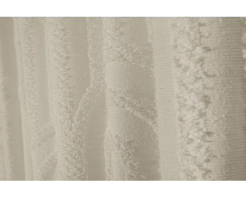 Närbild av en vit, strukturerad gardin