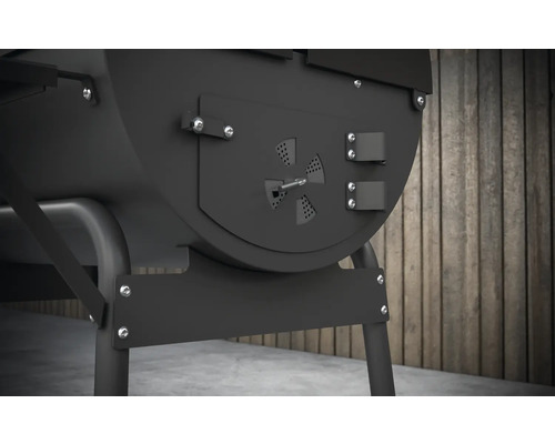 Detaljvy av en svart grillvagn med justerbar ventilation