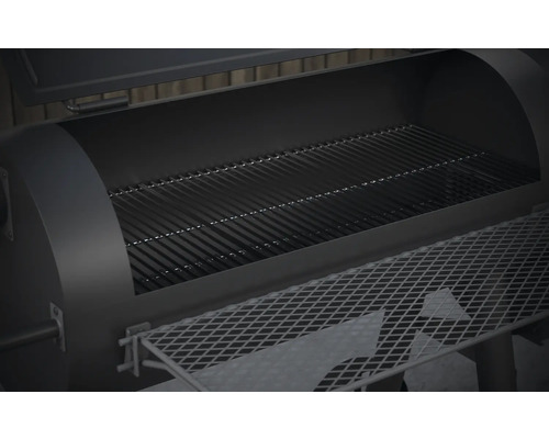 Invändig vy av en öppen grill med galler och förvaringshylla