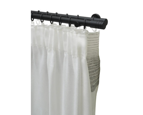 Dubbel gardinstång med vita och randiga gardiner