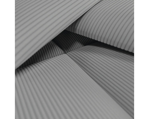 Närbild av ett möbeltyg med ribbat mönster