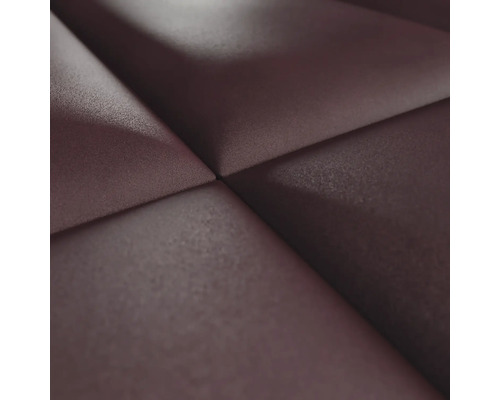 Närbild av en väggpanel med en tredimensionell textur