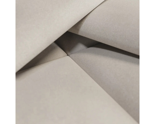 Detaljbild av ett ljust möbeltyg