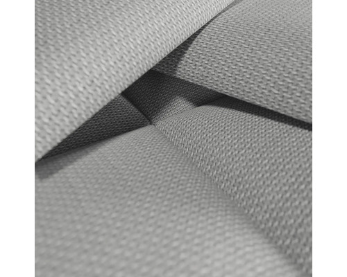 Närbild av ett grått möbeltyg.