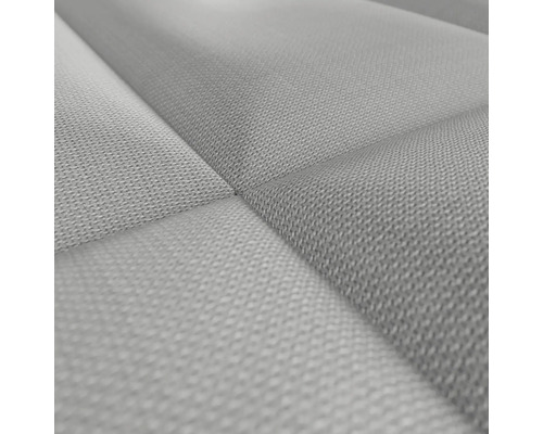 Närbild av en quiltad tygklädsel