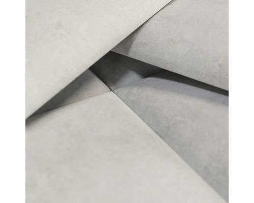 Närbild av ljusgrå betongstenar.