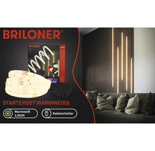 Briloner LED Stripe Starterset Varmvitt med ljus och soffa i bakgrunden