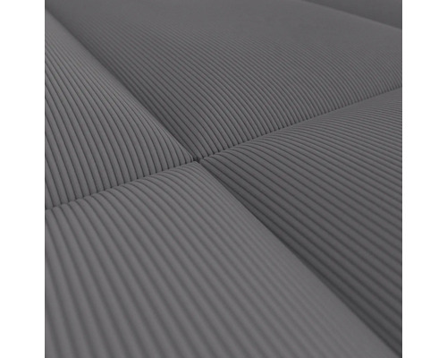 Närbild av en ribbad grå madrass