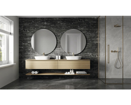 Modernt badrum med dubbla handfat, runda speglar och duschkabin