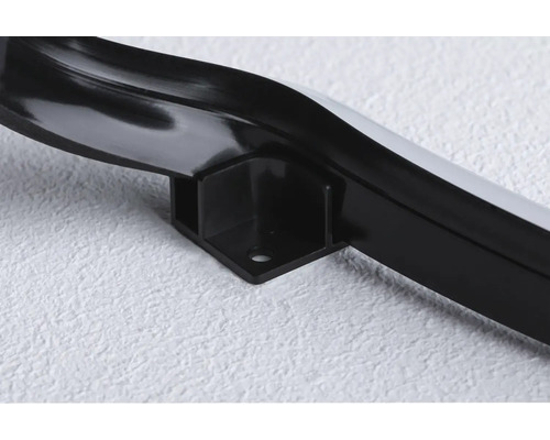 Närbild av en svart hörnlist med fäste