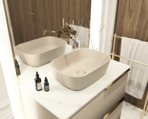 Badrumsmöbel med två tvättställsskålar och blandare