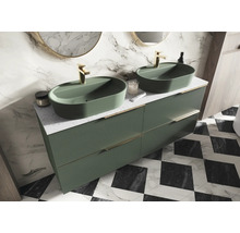 Badrum med dubbla handfat i grönt på ett underskåp med lådor