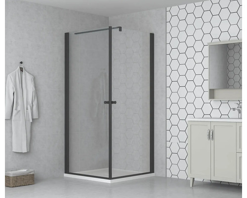 Duschkabin med svängdörr och tvättställ i badrum