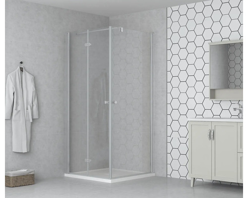 Badrum med duschkabin, tvättställsskåp och badrock på väggen