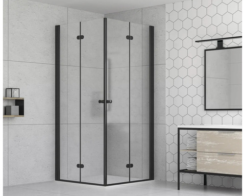 Hörndusch med svart ram i ljust badrum.