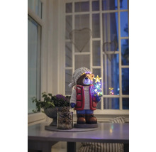 Dekorativ björnfigur med LED-julgran på ett bord i ett rum.