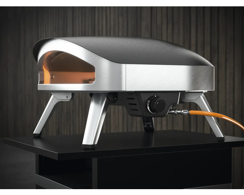 Pizza ugn tillverkad av rostfritt stål och stål på ett bord