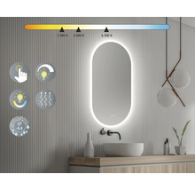 Badrum med belyst spegel, handfat och temperaturreglering