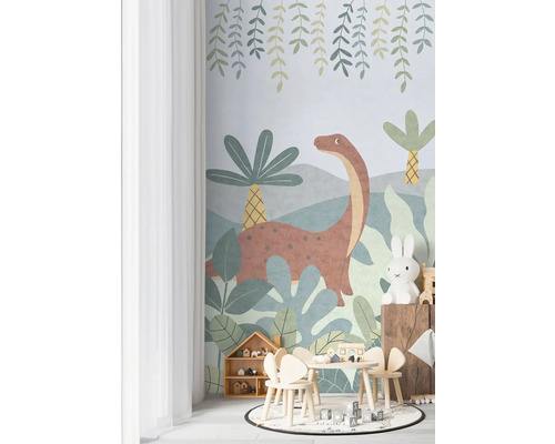 Barnrum med dinosaurietapet, bord, stolar och leksaker