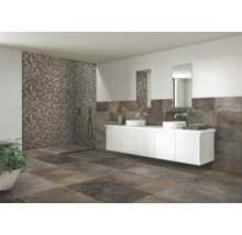 Badrum med dusch, handfat och kakel i modern design.