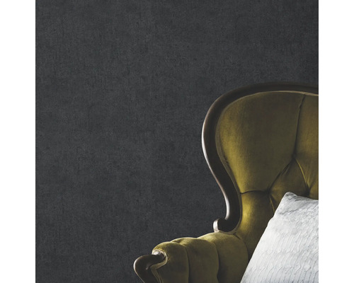 Närbild av en grå vägg med fåtölj