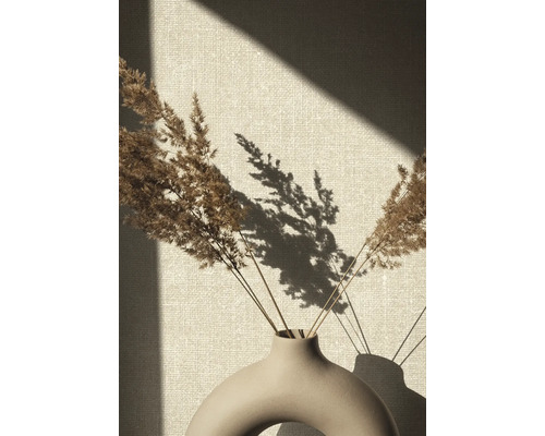 Dekorativa torkade gräs i en keramisk vas