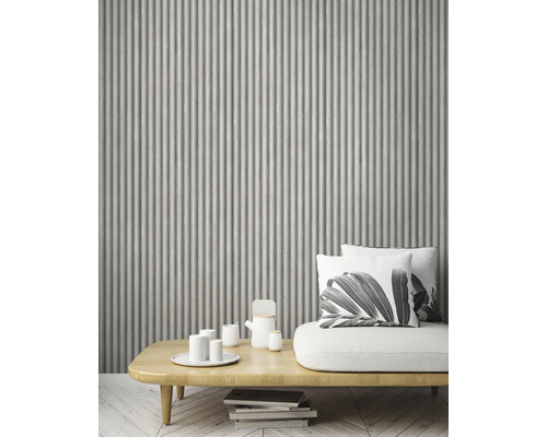 Dekorativ väggdesign med räfflad väggpanel i vardagsrummet.
