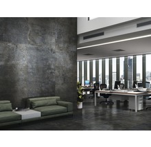 Modernt kontor med vägg- och golvplattor i betonglook, kontorsmöbler och sittgrupp