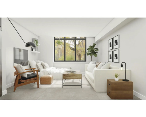 Vardagsrum med soffa, fåtölj, soffbord och dekoration