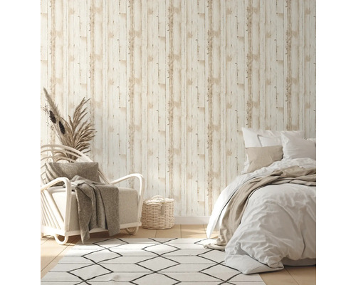 Sovrum med non-woven tapet i trälook, fåtölj och säng