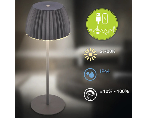 Bordslampa med lampskärm och symboler för ljusintensitet