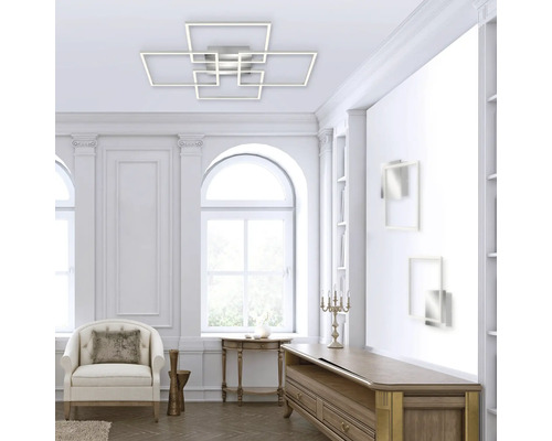 Vardagsrum med modern taklampa med geometriska former