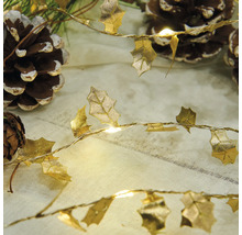 Dekorativ ljusslinga med bladform och kottar