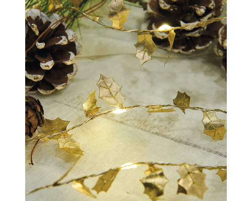 Dekorativ ljusslinga med bladform och kottar