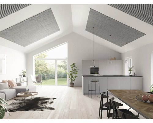 Ljust vardagsrum med akustikpaneler i taket, soffa, matbord och kök