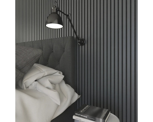 Sovrumsscen med säng, sängbord och vägglampa för sovrumsbelysning