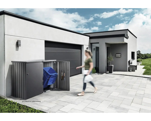 Soptunna i metall med öppna dörrar framför ett modernt hus