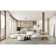 Vardagsrum med soffa, köksbänk och träelement för ett modernt boende