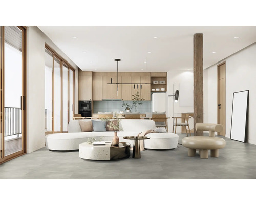 Vardagsrum med soffa, köksbänk och träelement för ett modernt boende