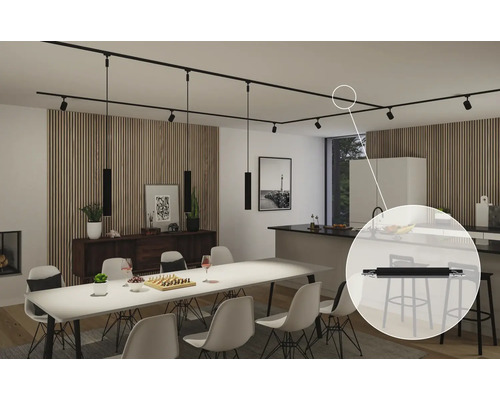 Vardagsrum med matbord och svart skensystem med spotlights och pendellampor