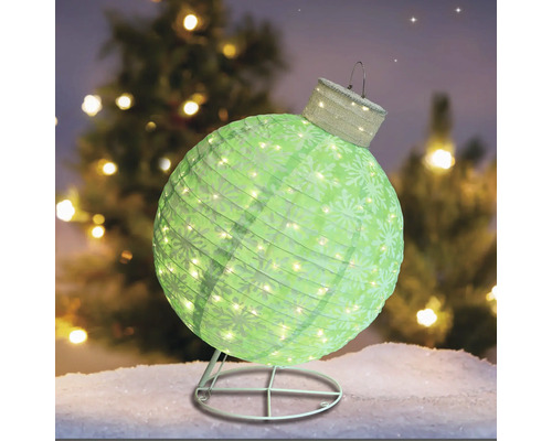 Dekorativ julkula med belysning på ett stativ