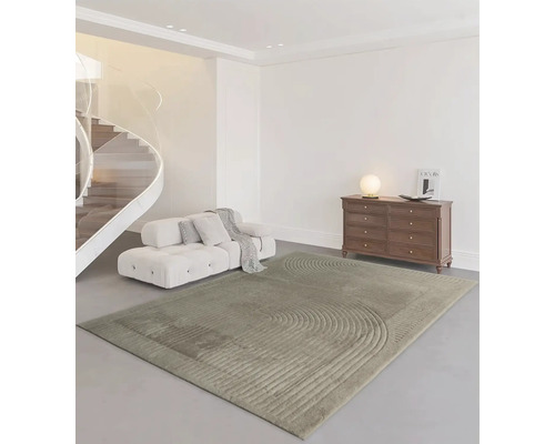 Modernt vardagsrum med matta, soffa och byrå