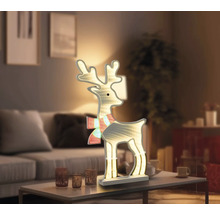 Dekorativ lysande ren för julperioden i vardagsrummet.