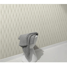 Scen med tredimensionell väggdesign, vit pall och grå handduk