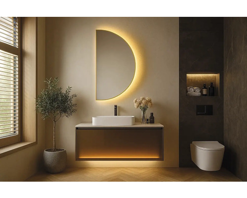 Modernt badrum med tvättställ, spegel med belysning och vägghängd toalett