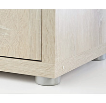 Detaljbild av en möbel med trästruktur och fötter