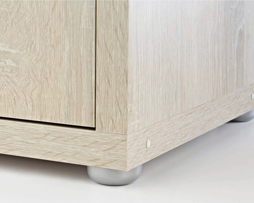 Detaljvy av möbel med trästruktur och ben