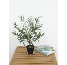 Konstgjort olivträd i kruka på ett träbord